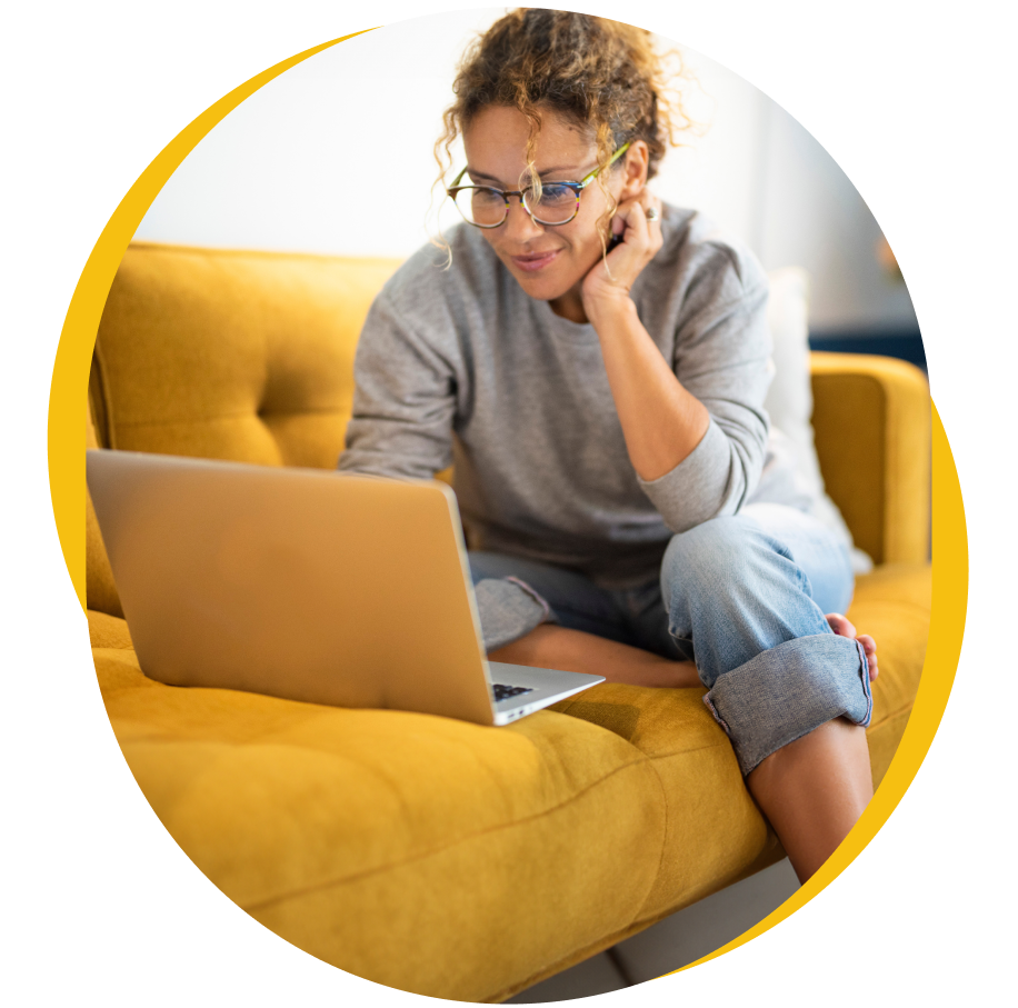 A woman reading on her laptop